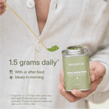 LANG:EN|Moringa powder being scooped from a tin, with a guide recommending 0.5 tsp daily, preferably in the morning with meals.