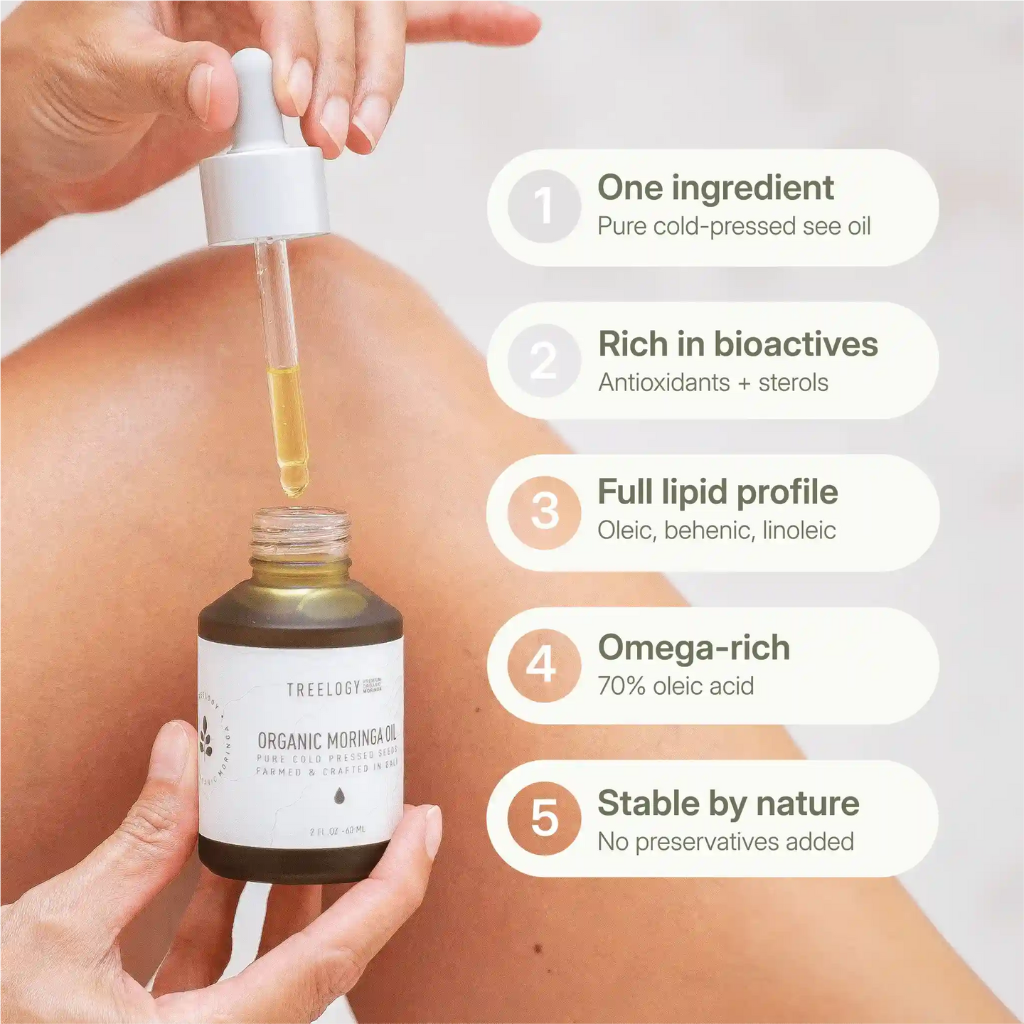 Treelogy Organic Moringa Oil dropper shown with five key benefits: one-ingredient formula, bioactives, omega-rich formula, no preservatives.