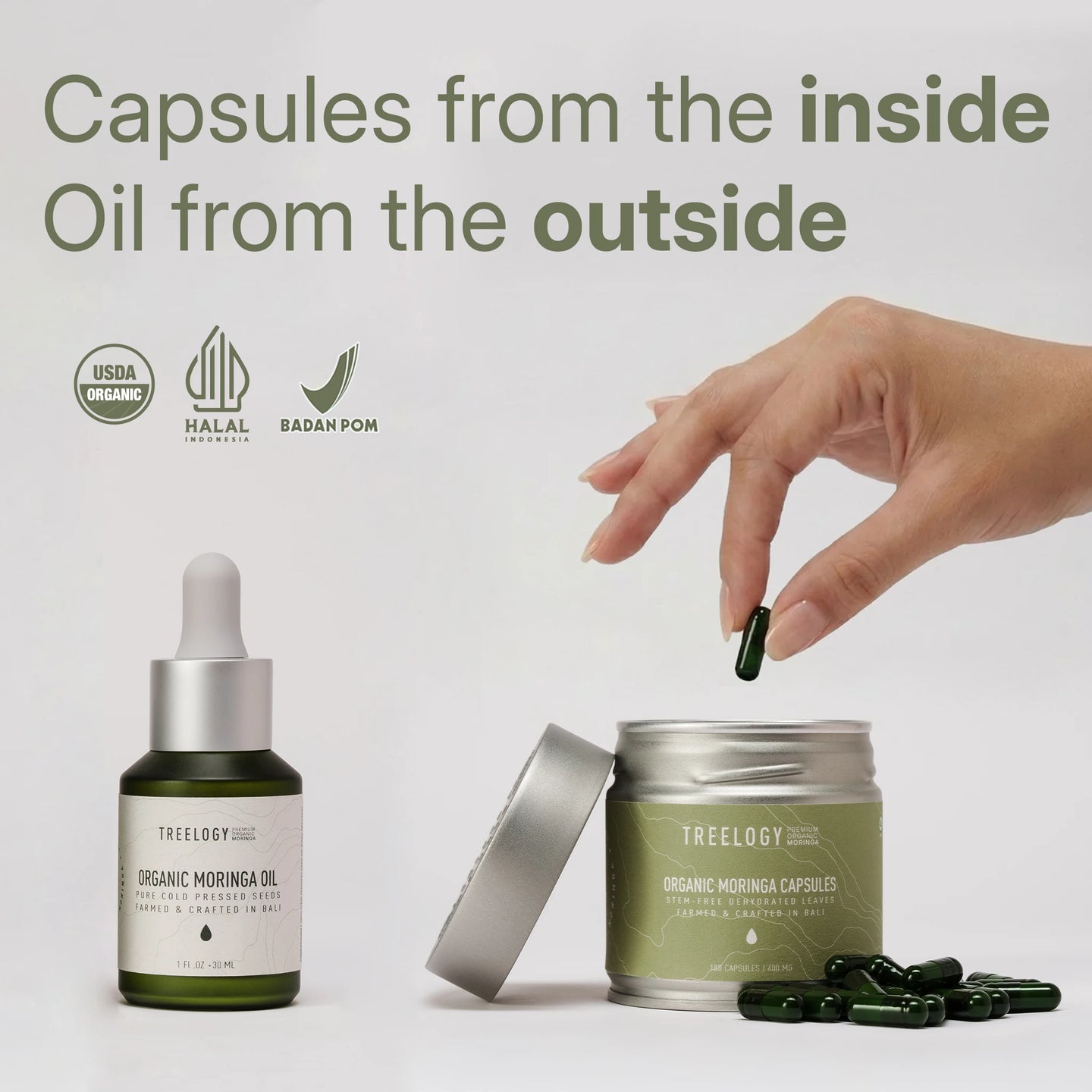 A hand drops a green Treelogy Organic Moringa Capsule into a tin, beside a bottle of Organic Moringa Oil with a dropper. The large text at the top reads: 'Kapsul dari dalam Minyak dari luar'. Featuring USDA Organic, Halal Indonesia, and BPOM certification logos, crafted in Bali, Indonesia.