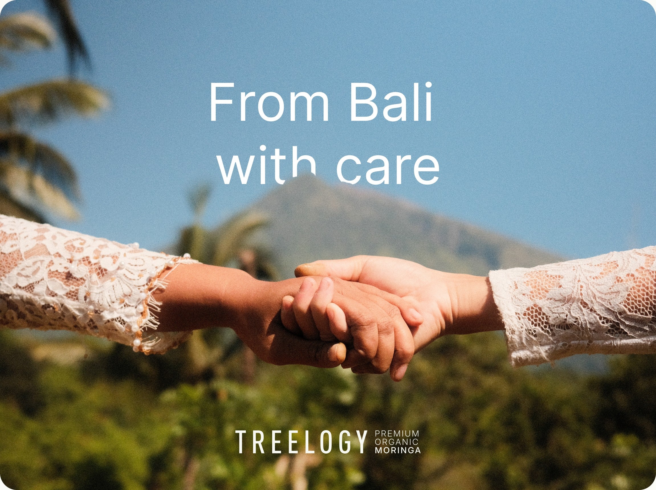 Dua tangan berjabat di depan gunung di Bali, dengan tulisan From Bali with care
