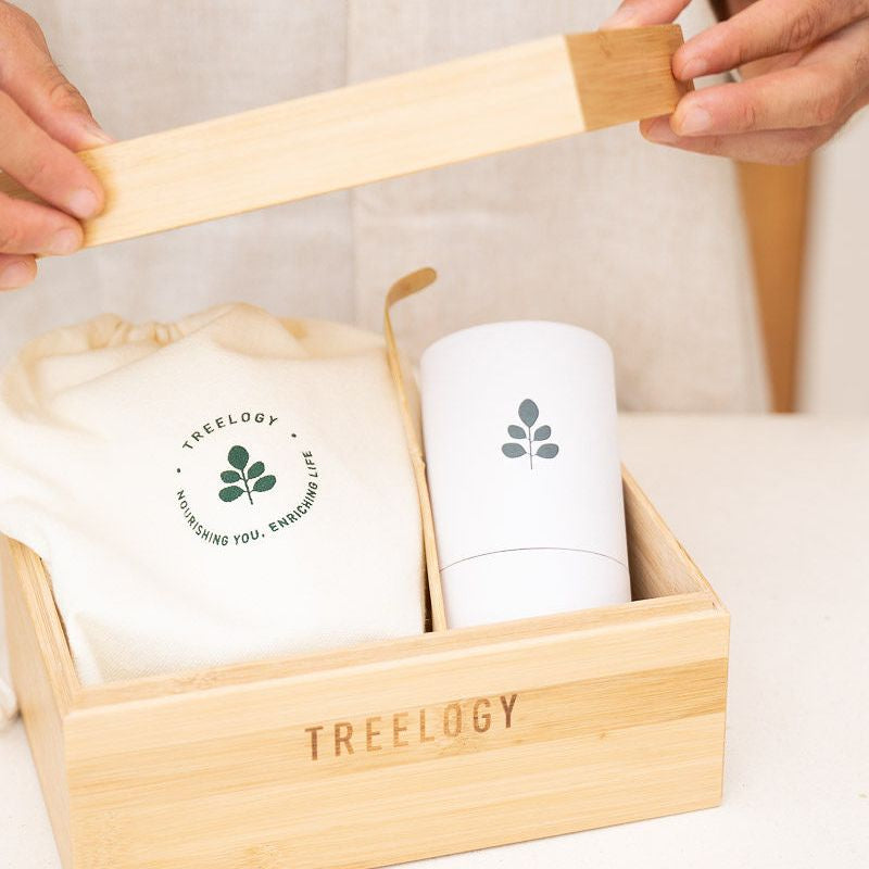 Treelogy Daily Wellness Bundle displayed with organic moringa oil, capsules, and ritual tools, highlighting a complete natural self-care routine.