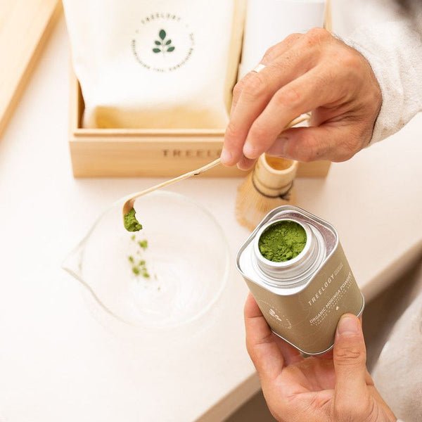 Flatlay of the Treelogy Moringa Ritual Bundle featuring organic moringa oil, capsules, a mixing bowl, and branded packaging, showcasing a holistic wellness set.